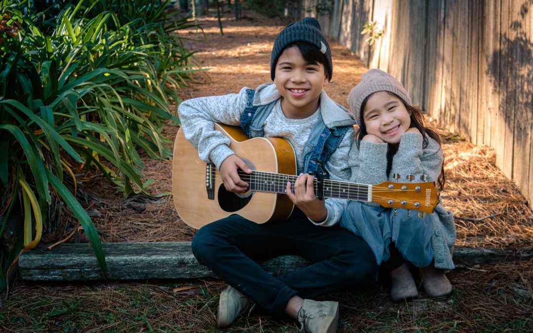 boy and girl with a guitar