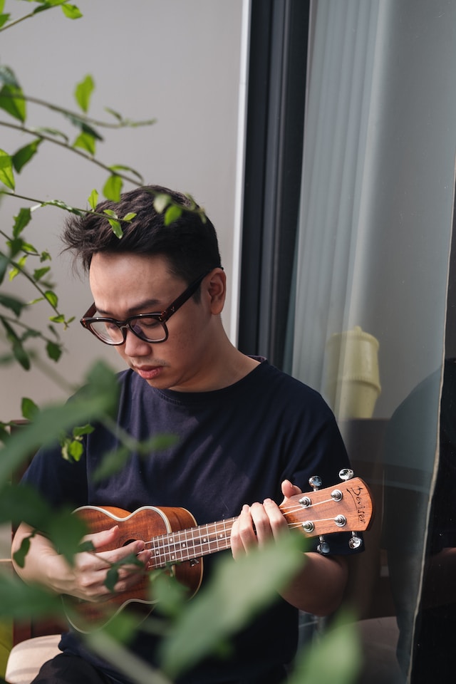 Young man playing ukulele